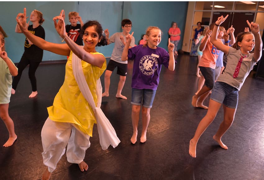 Sunitha Raj, artistic director at Nrithyanjali School of Dance in Greenville, teaches a class to students in Converse College's Lawson Academy of the Arts. Photo credit: Tim Kimzey of the Spartanburg Herald-Journal