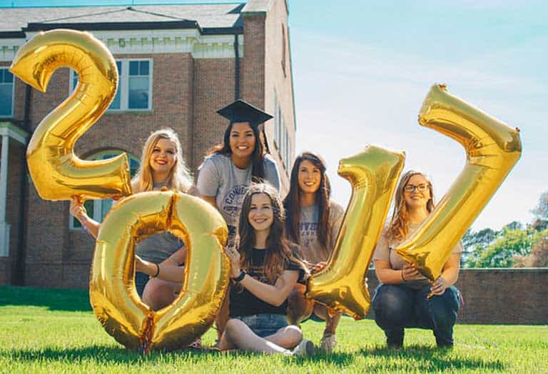 2017 graduates on back campus lawn