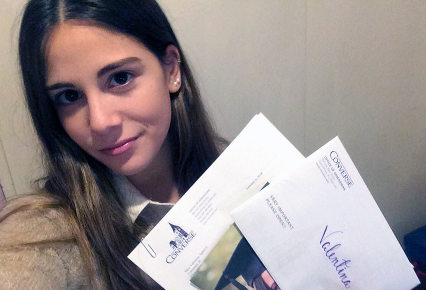 Valentina Aparicio of Germany holds her Converse scholarship award packet