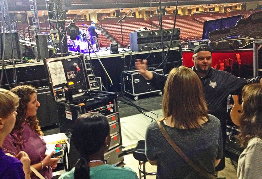 NeedtoBreathe tour manager Dustin Reynolds talks with Converse students