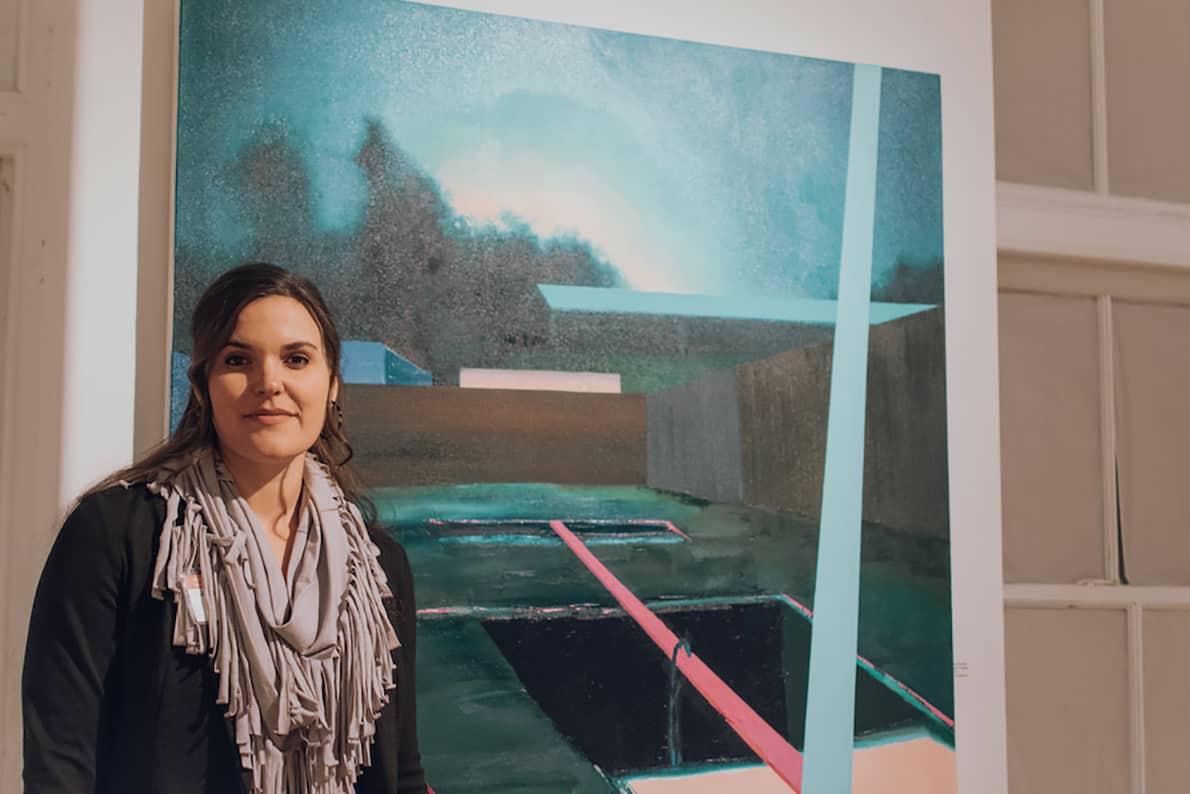 Jena Thomas with her artwork at the 701 CCA exhibition