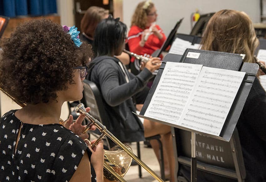Converse music student at a rehearsal
