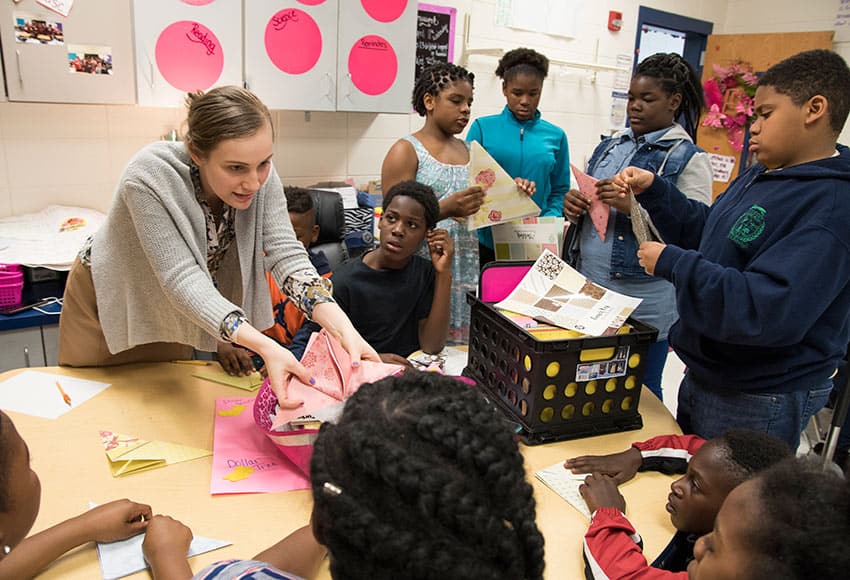 Photo of Converse student teaching origami
