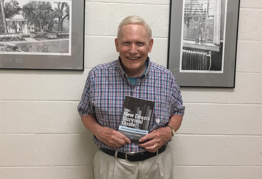 Dr. McDaniel holds his ninth book