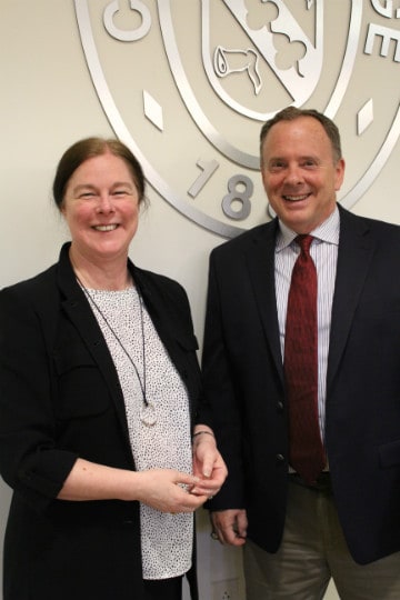 Lienne Medford and David Case in front of Converse logo