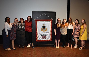 Converse students alpha lambda order of the torch