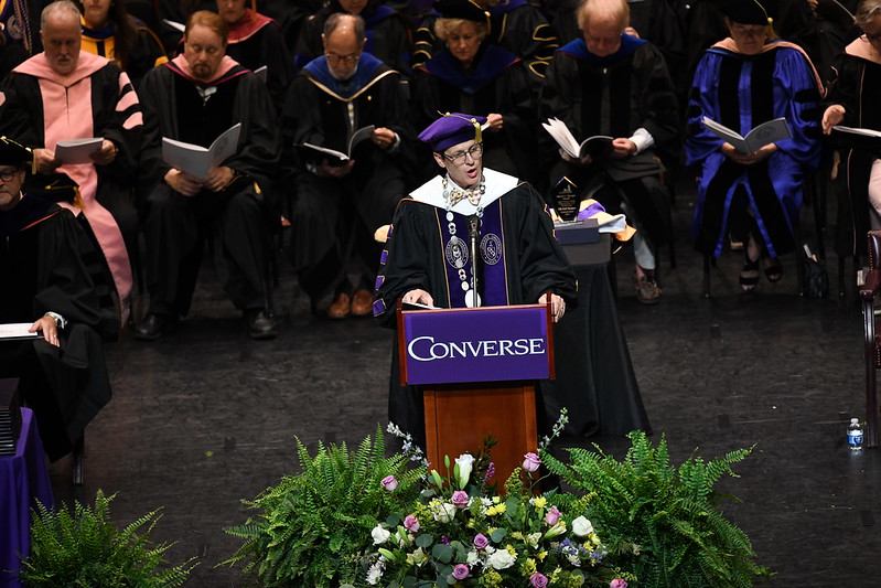 Overhead view of President Hopkins standing at the podium speaking at the Commencement ceremony.