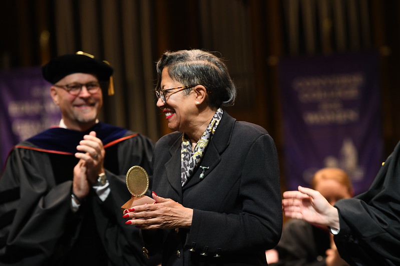 Dr. Woodward smiles at someone after receiving her award.