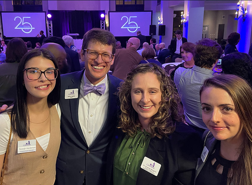 Photo of Presidential Student Ambassador Ryleigh Henderson, President Boone J. Hopkins, Assistant Professor of Mathematics and Data Science Dr. Amanda Mangum, and Associate Professor and Chair of the Mathematics Department Dr. Jessica Sorrells.