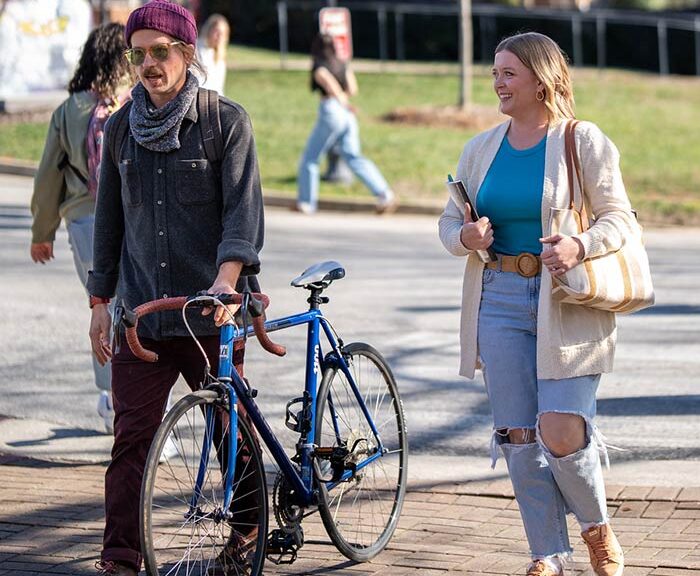 Adult college students walk across Converse campus