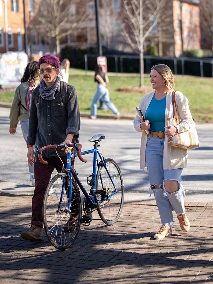 Adult college students walk across Converse campus