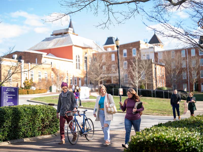 Converse students walk across campus in the spring.