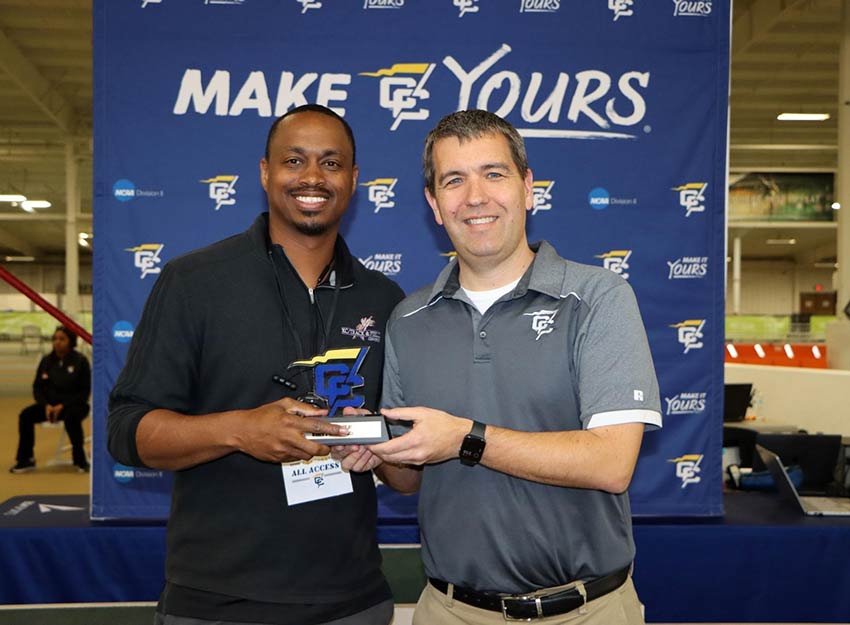 Coach Morton accepts an award.