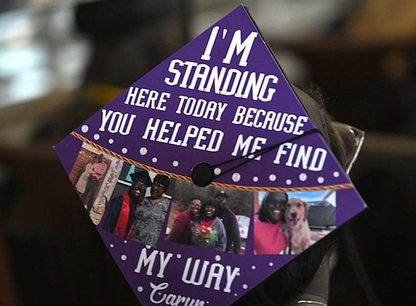 A decorated mortar board that says 'I'm standing here today because you helped me find my way."