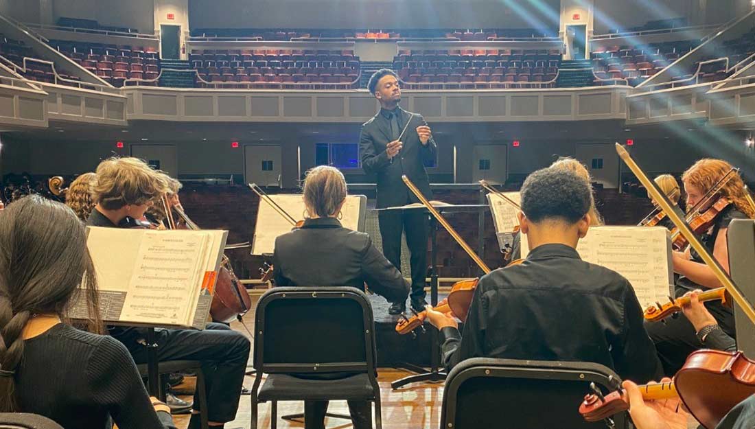 The youth orchestra performs for an audience
