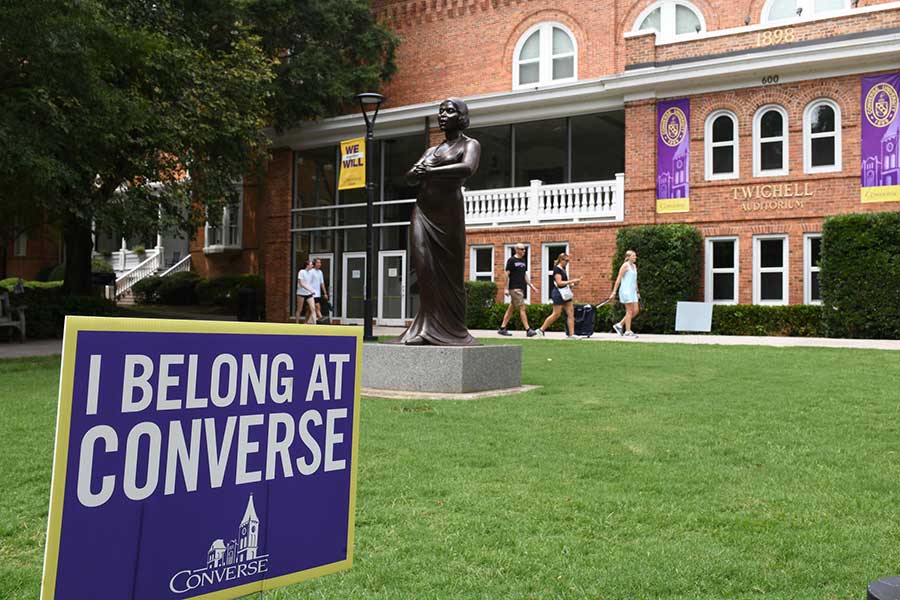 Front of Twichell Auditorium at Converse University with a sign that reads "I belong at Converse."