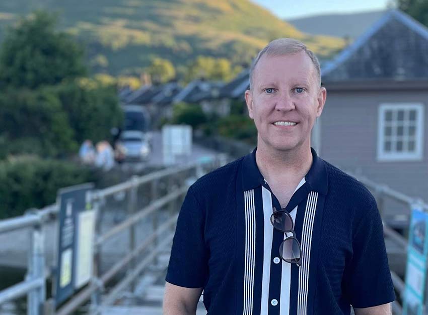 Portrait of Jack Knipe outdoors in a casual shirt