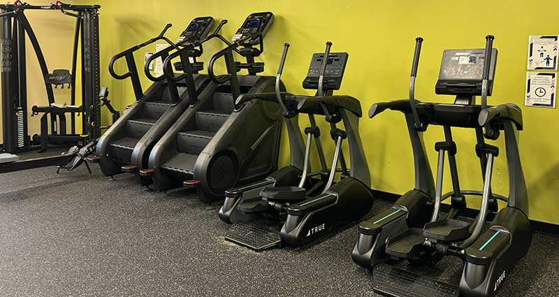 Two stairclimbers and two treadmills in the Converse fitness room.