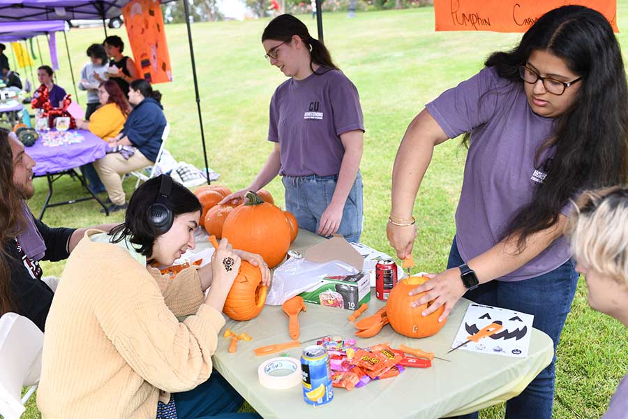 Converse students carve pumpkins during Homecoming week on Halloween.