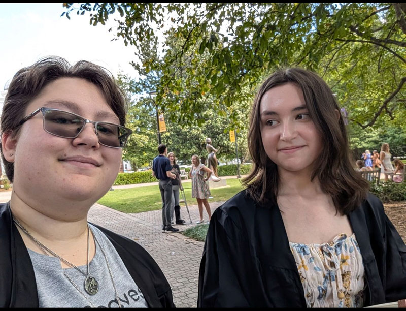 The Fortier siblings smile at an outdoor event on the Converse campus
