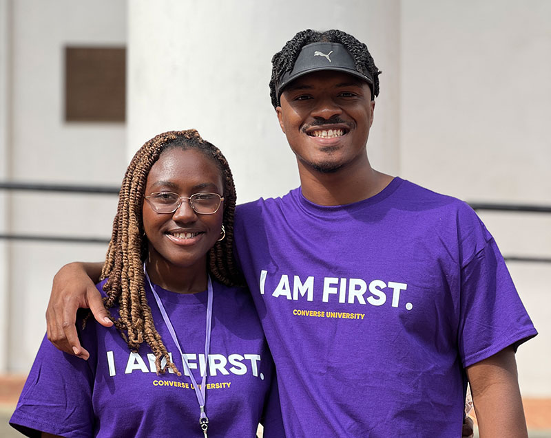 The Medley siblings smile while wearing Converse University 'I am first' t-shirts.