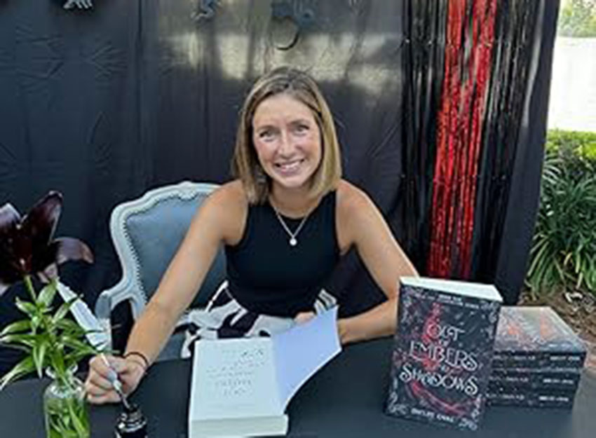 Shelby Oval signs copies of her new novel