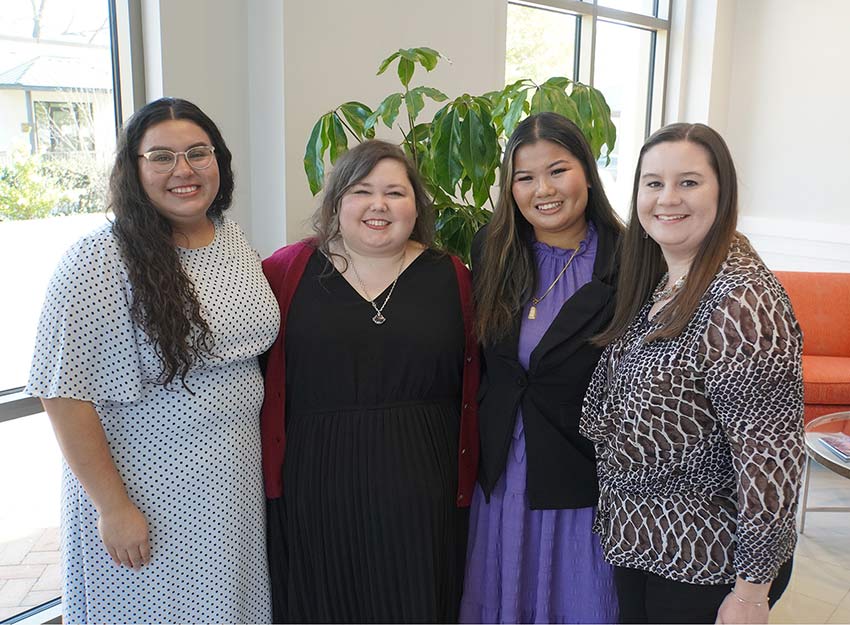 Photo of four Converse alumni and SCF staff