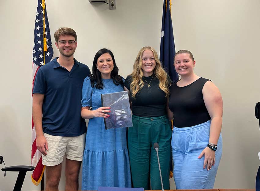 Representatives from Converse standing in an office at the SC State House where they advocated for basic needs for students across the state.